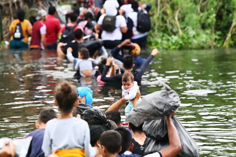 Migrant cross the Rio Grande in Matamors, Mexico, on their way to the U.S. on May 11, 2023.