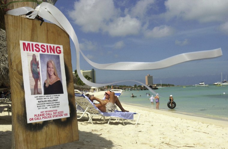 A missing poster for Natalee Holloway on Palm Beach in front of her hotel where she had been staying in Aruba on June 10, 2005.