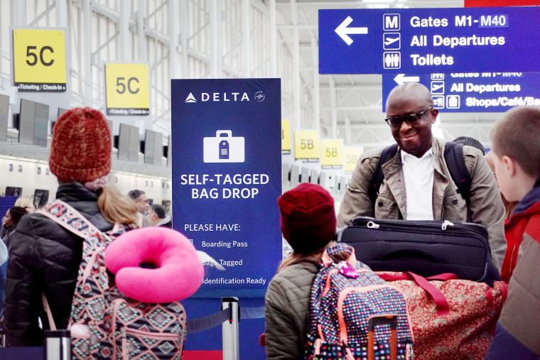 Passengers check in at Chicago’s O’Hare International Airport in January. 