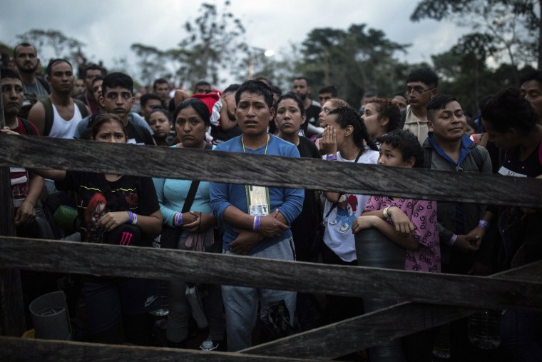 Image: Migrants who plan to start walking across the Darien Gap from Colombia to Panama in hopes of reaching the U.S. gather at the trailhead camp in Acandi, Colombia, on May 9, 2023. 