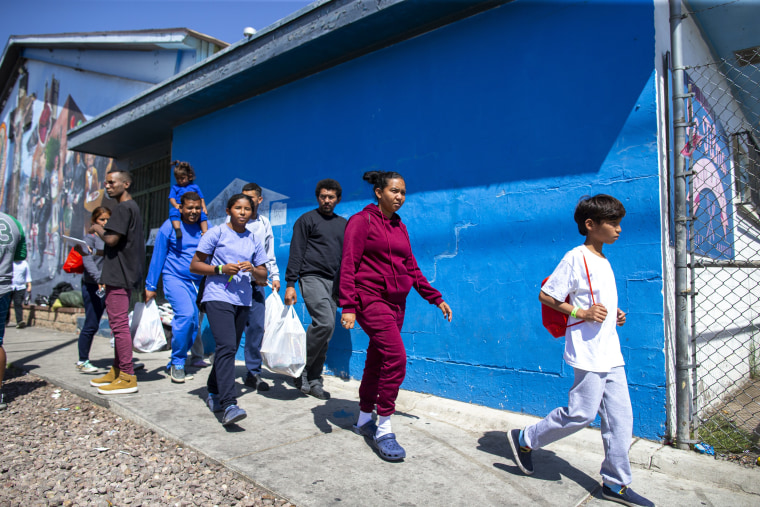 Image: A migrant family from Venezuela arrives at the shelter run by Sacred Heart Church in El Paso, Texas, on May 12, 2023.