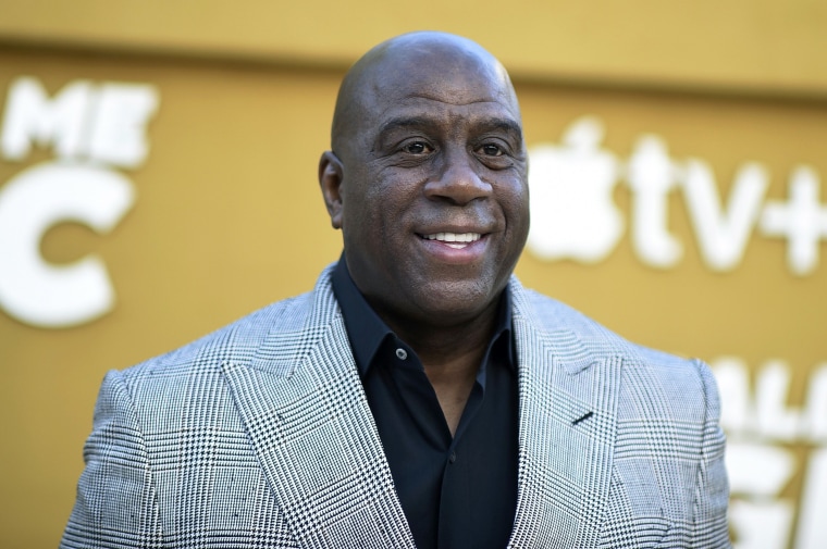 FILE - Magic Johnson arrives at the premiere of "They Call Me Magic" on Thursday, April 14, 2022, at Regency Village Theatre in Los Angeles. A group led by Josh Harris and Mitchell Rales that includes Magic Johnson has an agreement in principle to buy the NFL's Washington Commanders from longtime owner Dan Snyder for a North American professional sports team record $6 billion, according to a person with knowledge of the situation. The person spoke to The Associated Press on condition of anonymity Thursday, April 13, 2023, because the deal had not been announced. 