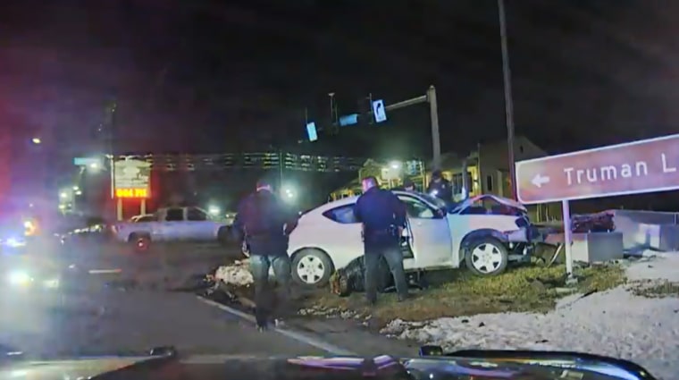Police surround Tyrea Pryor in a crashed car in Independence, Mo., in March 2022. 