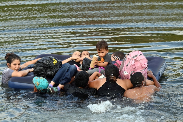 Migrants cross the Rio Grande in  Matamoros, Mexico