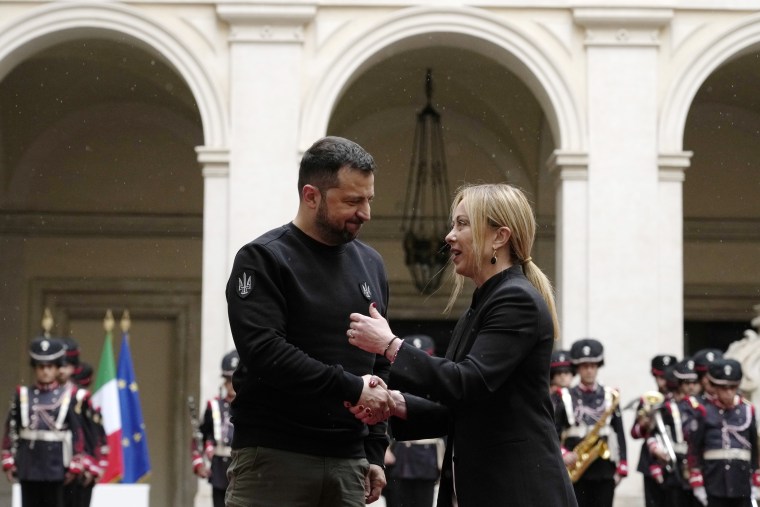 Ukrainian President Volodymyr Zelenskyy shakes hands with Italian Premier Giorgia Meloni at Chigi Palace in Rome