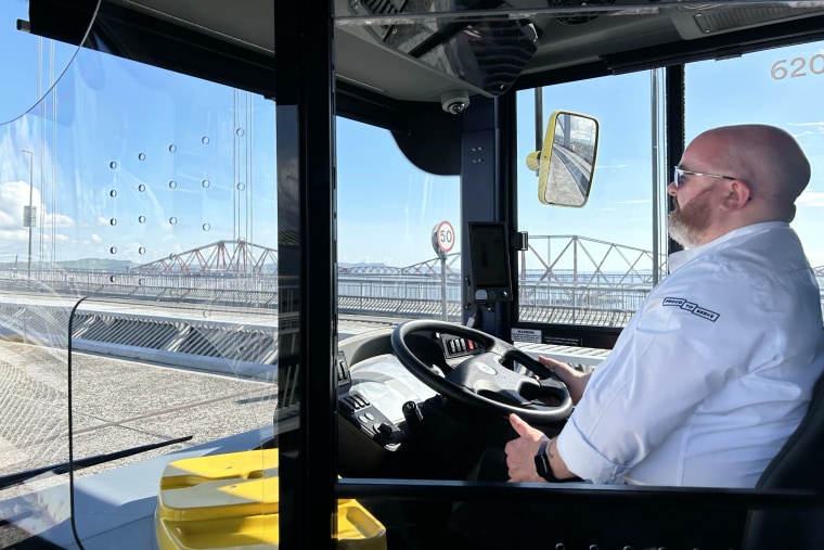 Safety driver Steven Matthew after he switches the bus onto autopilot driving over the Forth Road Bridge at the Queensferry Crossing.