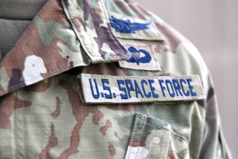 FILE - In this photo released by the U.S. Air Force, Capt. Ryan Vickers stands for a photo to display his new service tapes after taking his oath of office to transfer from the U.S. Air Force to the U.S. Space Force at Al-Udeid Air Base, Qatar, Tuesday, Sept. 1, 2020. The U.S. Air Force abruptly changed its procedures to select a permanent headquarters for the U.S. Space Command during the election year of 2020, which led to it choosing heavily Republican Alabama over Democrat-dominated Colorado after a White House meeting, according to a report from the General Accounting Office that was made public Thursday, June 2, 2022.