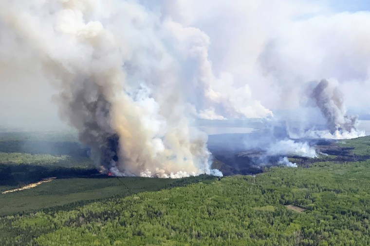 In this photo provided by the Government of Alberta, Canada, the Eagle Wildfire burns, Saturday, May 13, 2023. Wildfire officials in Alberta say hot, dry and windy weather has pushed fire conditions even further into the extreme in the province's north this weekend, and the situation in the south is now a growing concern.