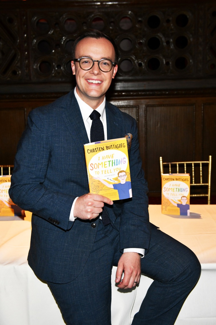Chasten Buttigieg holds his book, "I Have Something to Tell You: For Young Adults" in New York