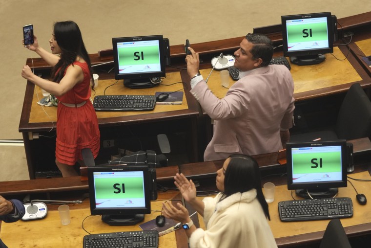 Lawmakers react after the impeachment to President Guillermo Lasso was approved by the National Assembly in Quito, Ecuador, on May 9, 2023.