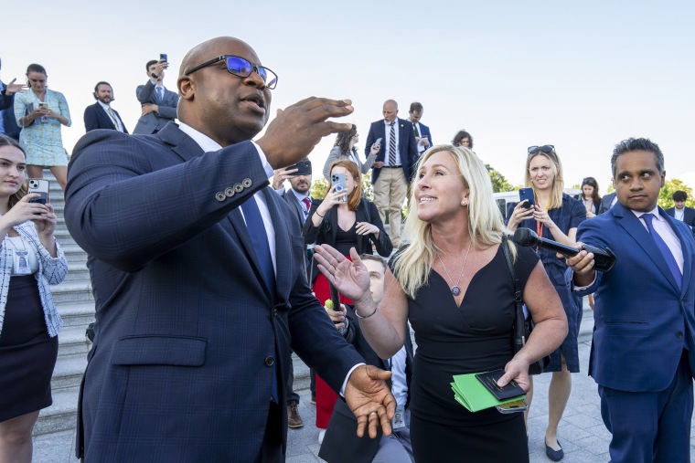 Rep. Jamaal Bowman, D-N.Y., left, and Rep. Marjorie Taylor Greene, R-Ga., argue on the steps of the Capitol after Bowman shouted down Rep. George Santos, R-N.Y., who was speaking to reporters following an effort to expel him from the House, in Washington, Wednesday, May 17, 2023. Santos has been charged with embezzling money from his campaign, falsely receiving unemployment funds and lying to Congress about his finances. He has denied the charges and has pleaded not guilty.
