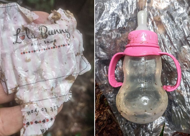 Items recovered in the forest include a hair band and water bottle.