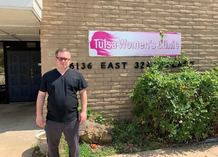 Ian Peake in front of the Tulsa Women's Clinic.