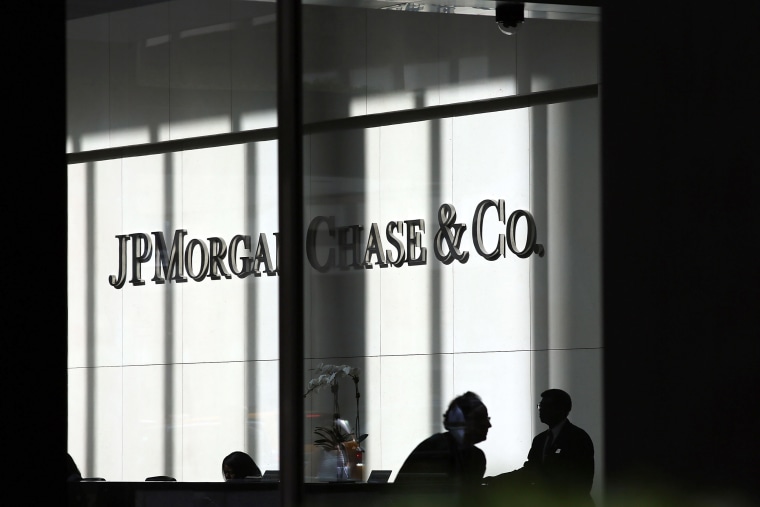NEW YORK, NY - OCTOBER 02:  People pass a sign for JPMorgan Chase & Co. at it's headquarters in Manhattan on October 2, 2012 in New York City. New York Attorney General Eric Schneiderman has filed a civil lawsuit against JPMorgan Chase alleging widespread fraud in the way that mortgages were packaged and sold to investors in the days that lead-up to the financial crisis. The allegations, which were filed in New York State Supreme Court, concern business that transpired during 2006 and 2007 at a now-defunct Bear Stearns, the failed Wall Street firm which was purchased in 2008 by JPMorgan Chase.  (Photo by Spencer Platt/Getty Images)