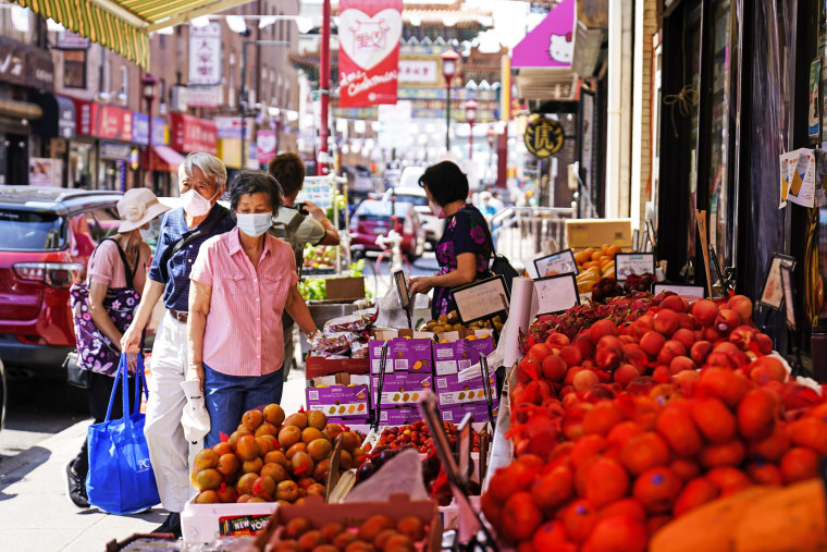 Customers shop for produce in the Chinatown neighborhood of Philadelphia