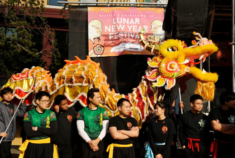 People watch a Lion Dance during a Chinese Lunar New Years celebration in Seattle
