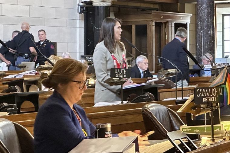 Sen. Kathleen Kauth of Omaha, a freshman lawmaker, speaks, Friday, May 19, 20230, in Lincoln, Nebraska, during debate on a bill that would ban gender-affirming care to minors. Kauth introduced the bill – which has been the flashpoint this session. Omaha Sen. Machaela Cavanaugh, foreground, led an effort to filibuster nearly every bill to block the ban from passing.