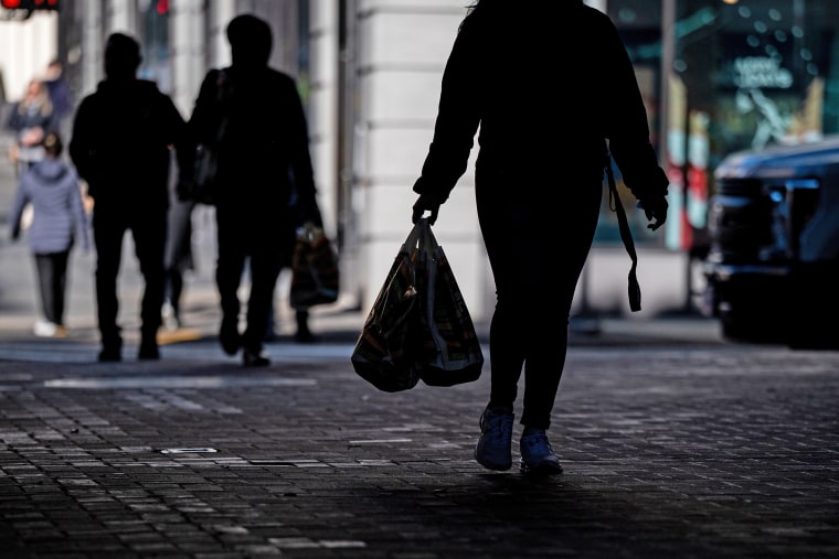 A shopper carrying bags in San Francisco.