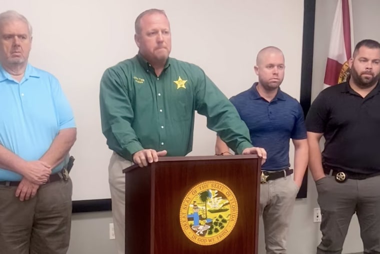 Sheriff John Tate speaks during a news conference in Holmes County, Fla.