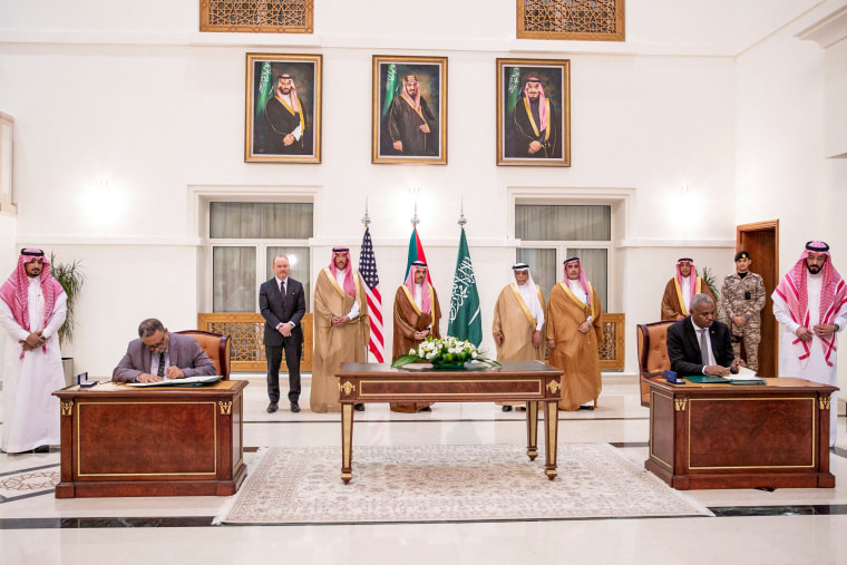 Representatives of the Sudanese army and the rival Paramilitary Rapid Support forces sign a ceasefire agreement in Jeddah, Saudi Arabia, on May 21, 2023.