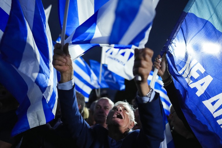 Prime Minister Kyriakos Mitsotakis and his conservative party are leading Greece's election by a wide margin, according to partial official results, but a new electoral law means he will be unable to form a government without seeking coalition partners, and a second election is likely. 