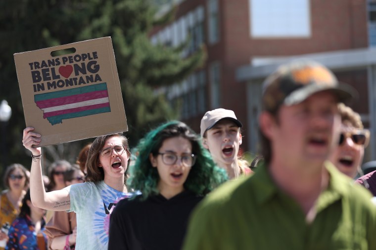 Transgender rights activists march through the University of Montana campus on May 3, 2023 in Missoula.