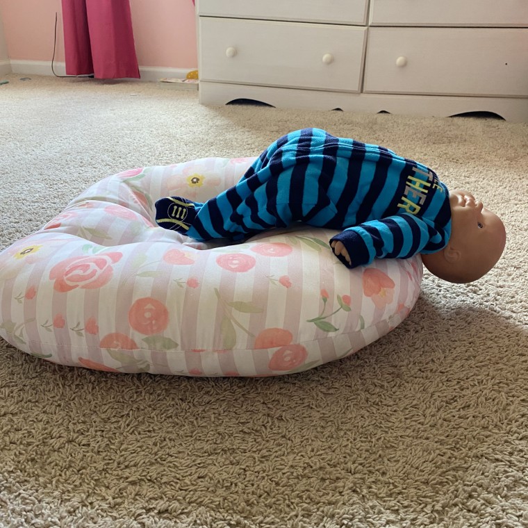 Image: A 3-month-old was found hanging off a Boppy lounger after the child kicked her legs, pushing herself upward, according to a report submitted by a parent to the CPSC in 2020.