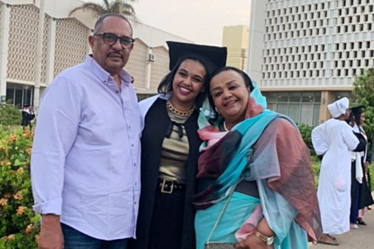 Zaria Suleiman, right, with her husband and one of her daughters at a university graduation in Khartoum.