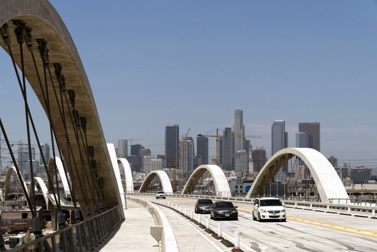 FILE - Cars move along the 6th Street Viaduct in Los Angeles, Wednesday, July 27, 2022. Police say a 17-year-old boy slipped and fell to his death this weekend while climbing a Los Angeles bridge in an apparent social media stunt. (AP Photo/Jae C. Hong, File)