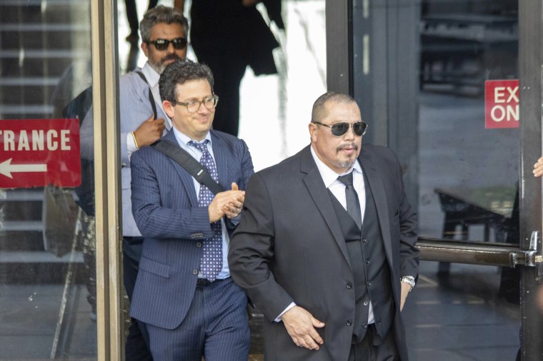 This undated photo, provided the by Los Angeles District Attorney's Office, shows Daniel Saldana, right, flanked by his lawyer Mike Romano, center, and fellow exoneree Frankie Carrillo, back left. Saldana, who spent 33 years in California prison for attempted murder, has been declared innocent and freed.