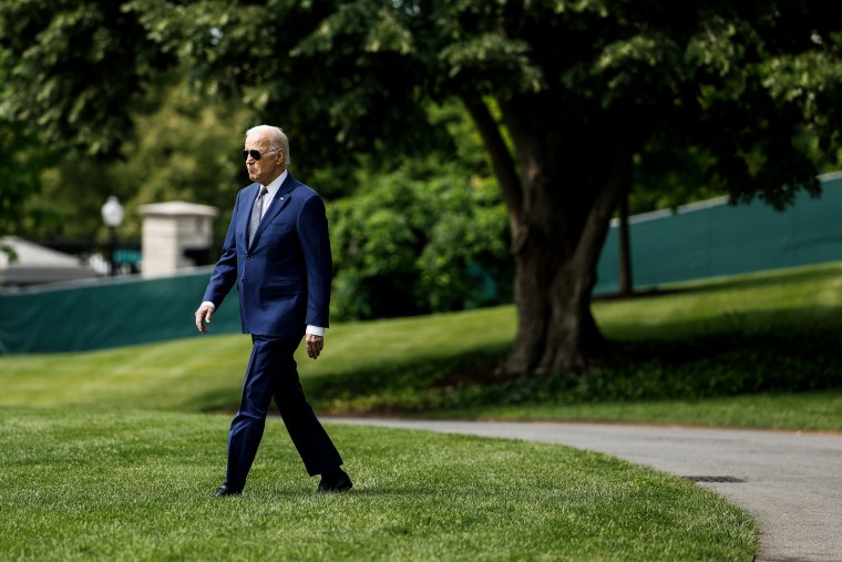 President Joe Biden walks on the South Lawn of the White House on May 10, 2023. 