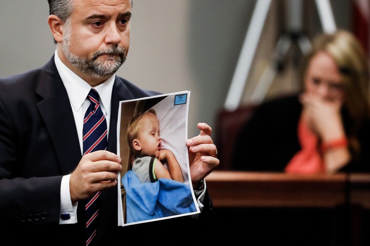 Defense attorney Maddox Kilgore holds a photo of Cooper Harris during a murder trial for his father Justin Ross Harris on Oct. 31, 2016  in Brunswick, Ga. 