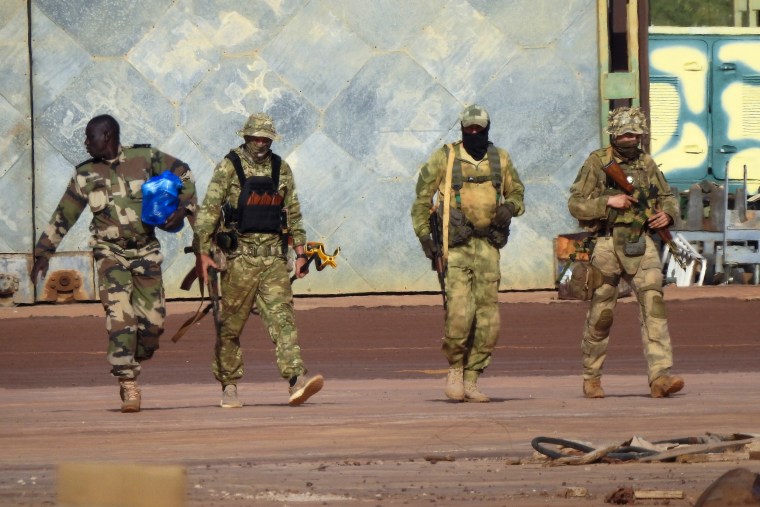 FILE - This undated photo released by the French military shows three Russian mercenaries, right, in northern Mali.  Russia's Wagner Group, a private military company run by Yevgeny Prigozhin, a rogue millionaire with long-standing ties to Russia's President Vladimir Putin, has played a key role in the fighting in Ukraine and also deployed its personnel to Syria, Central African Republic, Libya and Mali.  .  (French Army via AP, File)