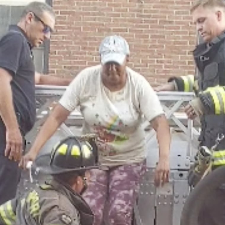 Lisa Brooks is rescued more than 24 hours after her apartment building in Davenport, Iowa, partially collapsed. 