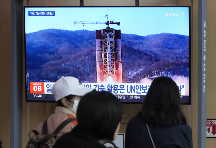 A TV screen shows a file image of North Korea's rocket launch during a news program at the Seoul Railway Station in Seoul, South Korea