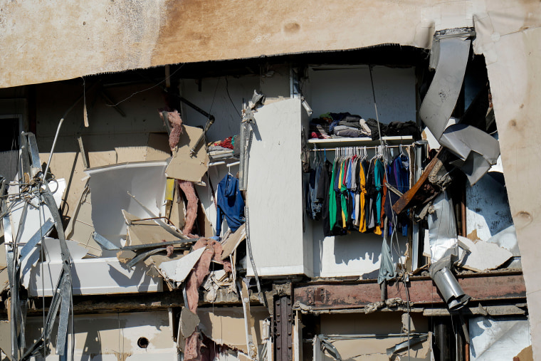 Clothes hanging in an apartment in the building that partially collapsed.