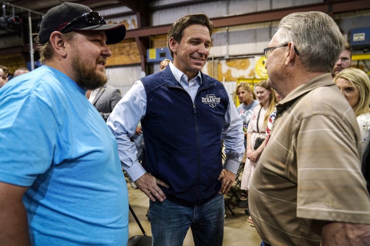 Image: Republican presidential candidate Florida Gov. Ron DeSantis talks with an audience members during a campaign event at Port Neal Welding on May 31, 2023, in Salix, Iowa.