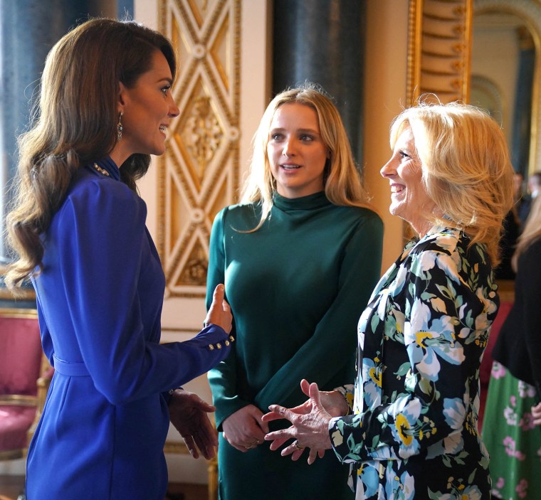Britain's Catherine, Princess of Wales (L) speaks with US First Lady Jill Biden (R) and her grand daughter Finnegan Biden 