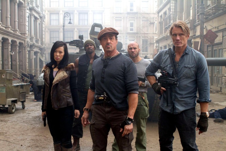 Yu Nan, Terry Crews, Sylvester Stallone, Randy Couture, Dolph Lundgren, in The Expendables, 2012. 
