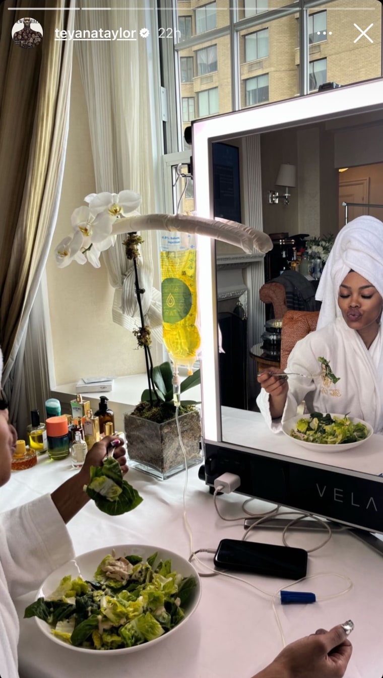 Teyana Taylor with a salad and IV drip.