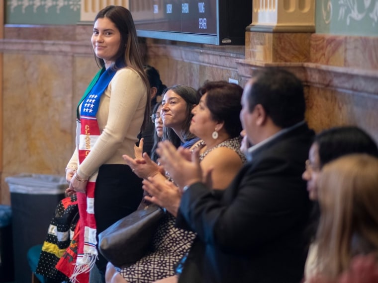 Student Naomi Peña Villasano receives applause from attendees at the Colorado House of Representatives on May 5, 2023.