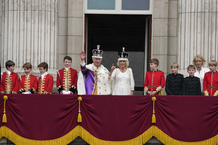 Britain's King Charles III and Queen Camilla greet the crowds from the balcony of Buckingham Palace