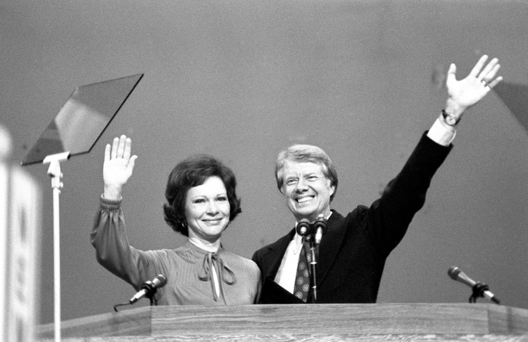 Jimmy and Rosalynn Carter wave to assembled Democratic National Convention after he accepted his party's nomination for president.