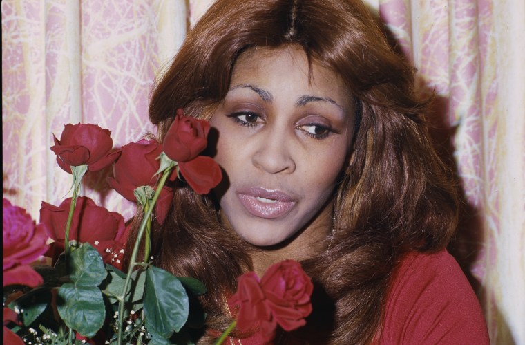 Tina Turner Holding Red Roses