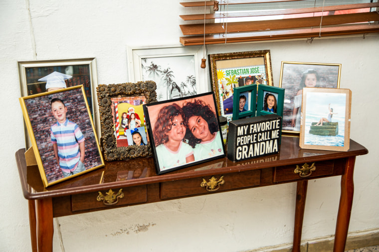 Family photographs of the grandchildren of Irma Martinez Rodriguez, 74, and Jose Luis Leon Figueroa, 67, at their home in Guanica, Puerto Rico, on May 29, 2023.