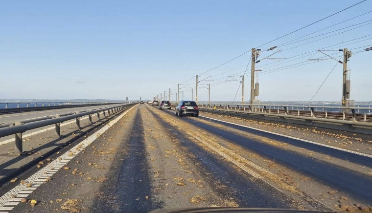 Potatoes are scattered across the road on Denmark's Great Belt Bridge on June 1, 2023. 
