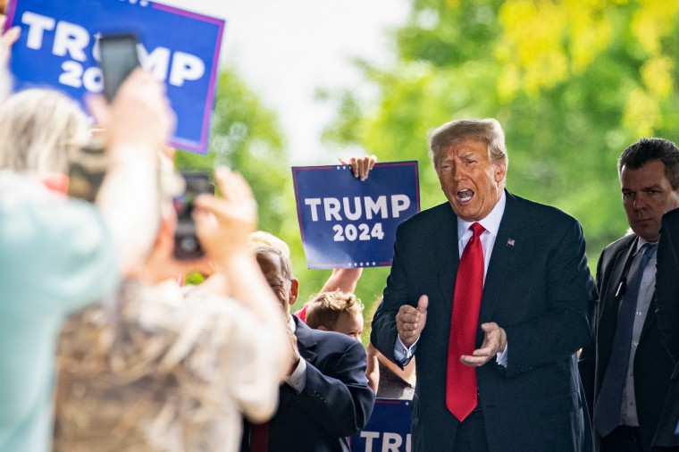 Image: Former President Donald Trump arrives to meet with local Republican leaders at the Machine Shed restaurant in Urbandale, Iowa, on  June 1, 2023. 