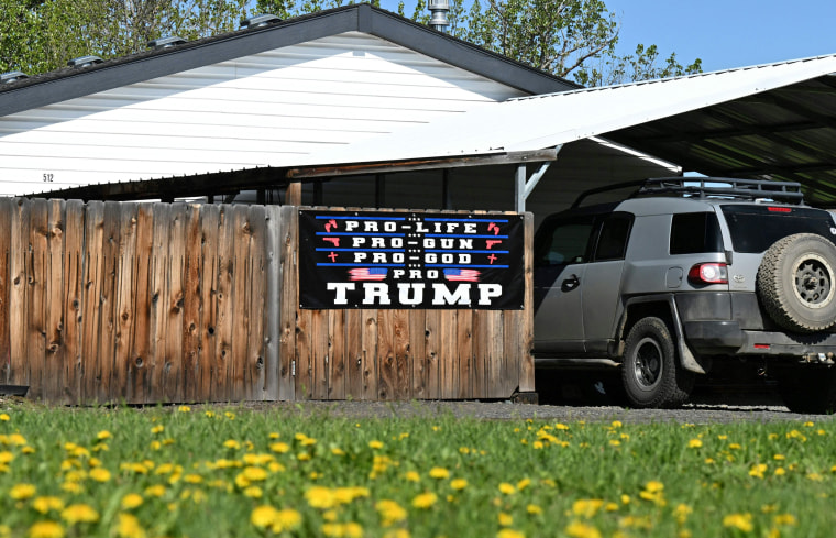 A sign in support of former President Donald Trump is displayed in front of a home in Wallowa, Ore., on May 12, 2023. 