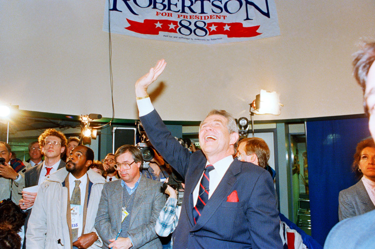 Pat Robertson waves to supporters Des Moines, Iowa, on Feb. 9, 1988. 