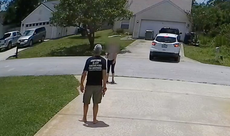 Terry Vetsch argues with a woman after her friend used his drive way to back up his car in Palm Coast, Fla.